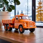 cinematic_photo_3d_printed__orange_pla_skin_texture__a_bear_drive_simple_tatra148_truck__a_bear_drive__smooth__3d_printed_toy__on_a_desk__lora_tatra148_sdxl_b_1_____35mm_photograph__fil_1128404253.jpg