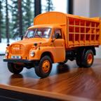 cinematic_photo_3d_printed__orange_pla_skin_texture__bear_animal_inside_tatra148_truck__a_bear_drive__smooth__3d_printed_toy__on_a_desk__lora_tatra148_sdxl_b_1_____35mm_photograph__film_2491073305.jpg