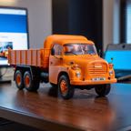 cinematic_photo_3d_printed__orange_pla_skin_texture__tatra148_truck__bear_driving__smooth__3d_printed_toy__on_a_desk__lora_tatra148_sdxl_b_1_____35mm_photograph__film__bokeh__profession_4231024150.jpg