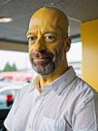 cinematic_photo_bald_man__yellow_painted_skin_and_head__male_focus__beard__close_up_on_face__funny_smile__white_shirt_40_y_o__homer_simpson_character_01_5____35mm_photograph__film__boke_3149592145.jpg
